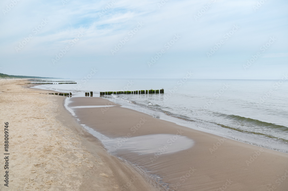 Baltic Sea - blue sky, beach, wave sea and waterbreak. Baltic Sea - blue sky, beach, wave sea and waterbreak.