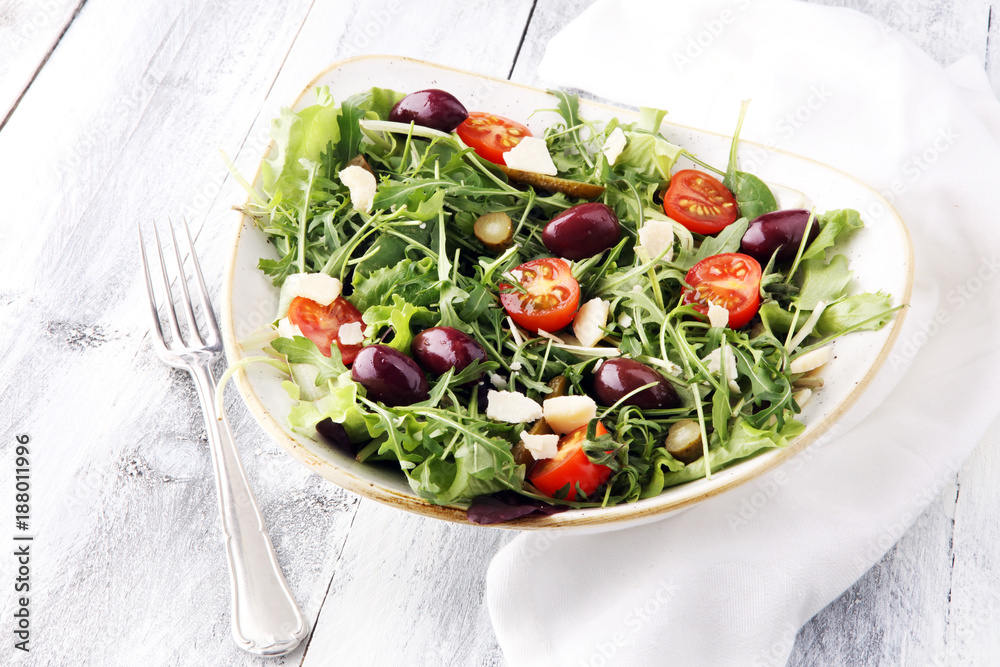 Salad with cheese and fresh vegetables and arugula. Greek salad.