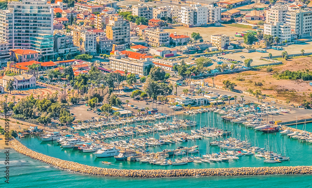 Sea port city of Larnaca, Cyprus. View from the aircraft to the coastline, beaches, seaport and the architecture of the city of Larnaca.