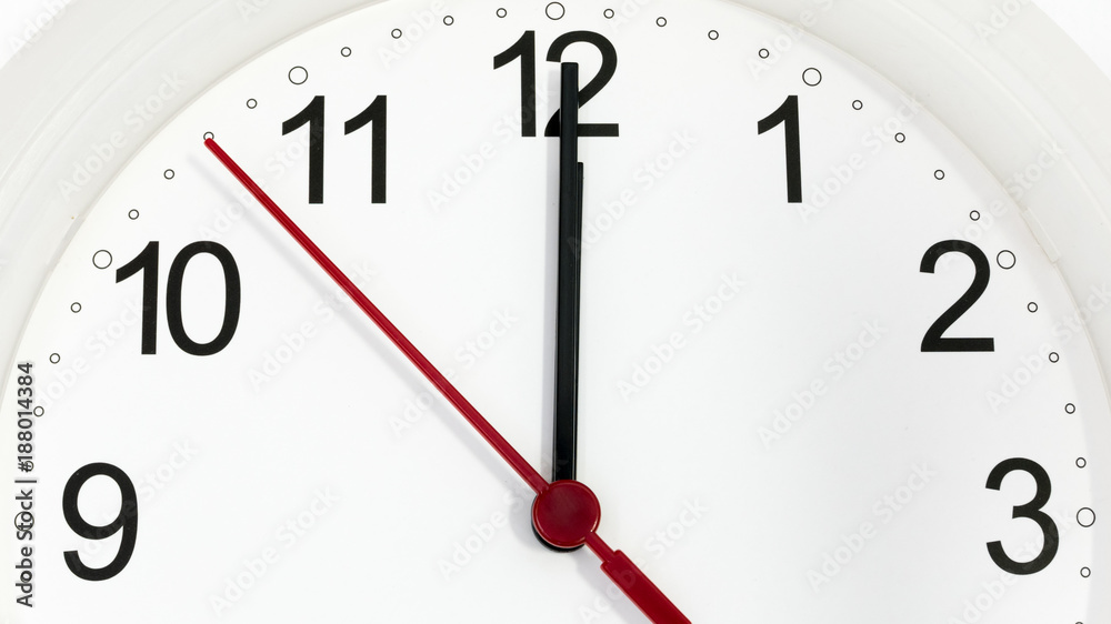 Closeup clock ticking showing twelve hours Closeup clock ticking showing twelve hours