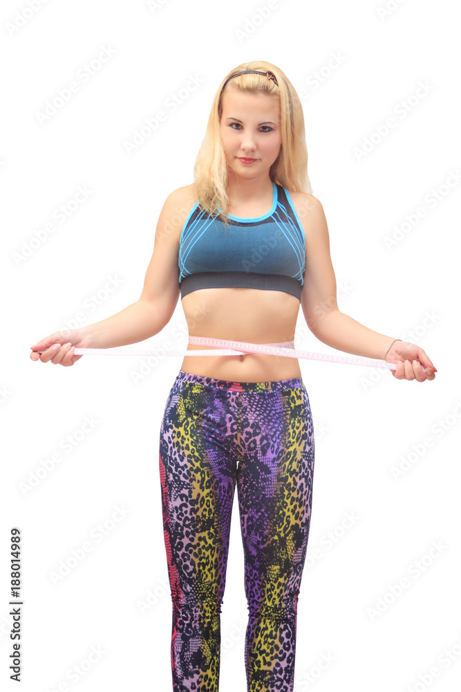 skinny sporty girl measuring her waist skinny sporty girl measuring her waist