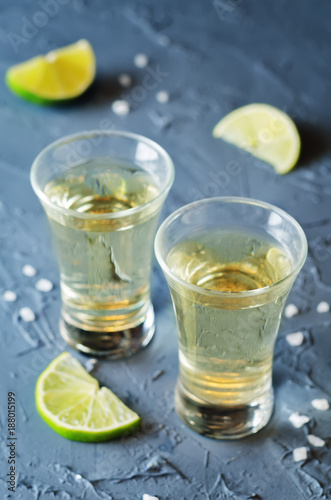 Tequila in glasses with lime and salt