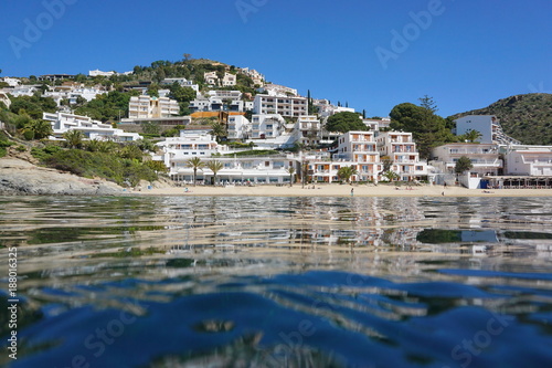 Spain Catalonia coastal town with sandy beach, Mediterranean, seen from sea surface, Costa Brava, playa Almadrava, Canyelles Grosses, Roses, Girona photo