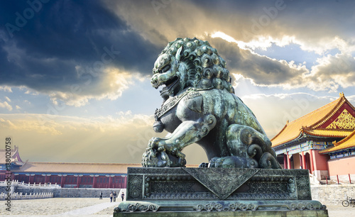 Chinese guardian lion. People are visiting. Located in The Palace Museum (Forbidden City), Beijing, China.