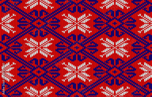 Knitted pattern with snowflakes in National colors of Norway. Woolen seamless knitted pattern