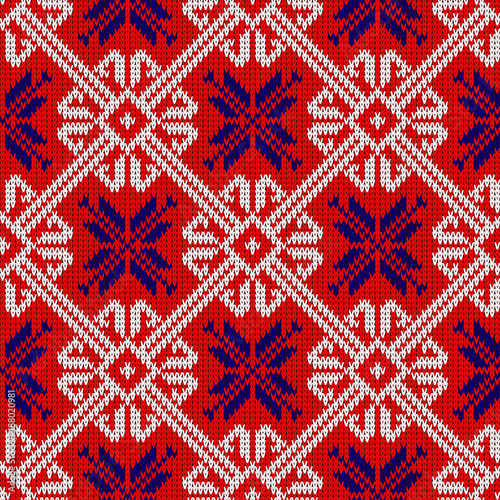 Knitted pattern with snowflakes in National colors of Norway. Woolen seamless knitted pattern