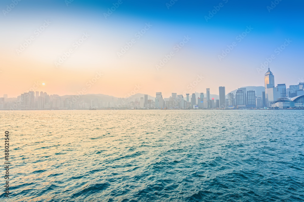 Hong Kong in the morning. Victoria Harbour. Taken from Avenue of Stars. Located in Hong Kong.