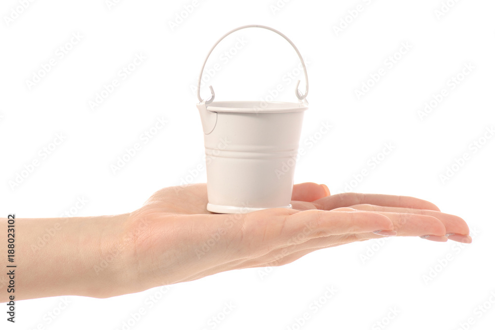 Small white bucketin hand Small white bucketin hand