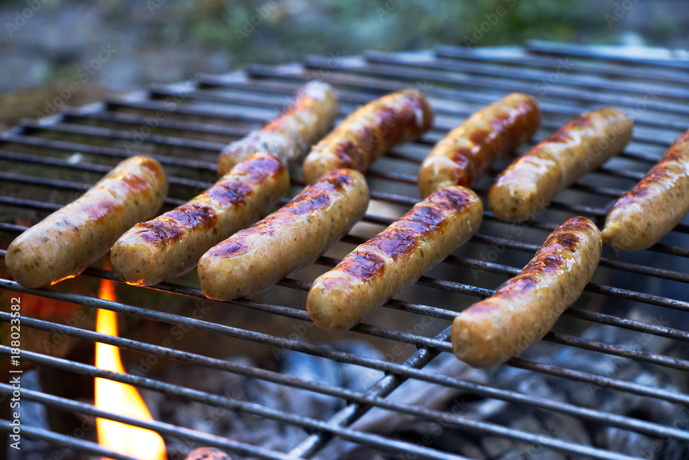German sausages on the grill, outdoor barbecue German sausages on the grill, outdoor barbecue