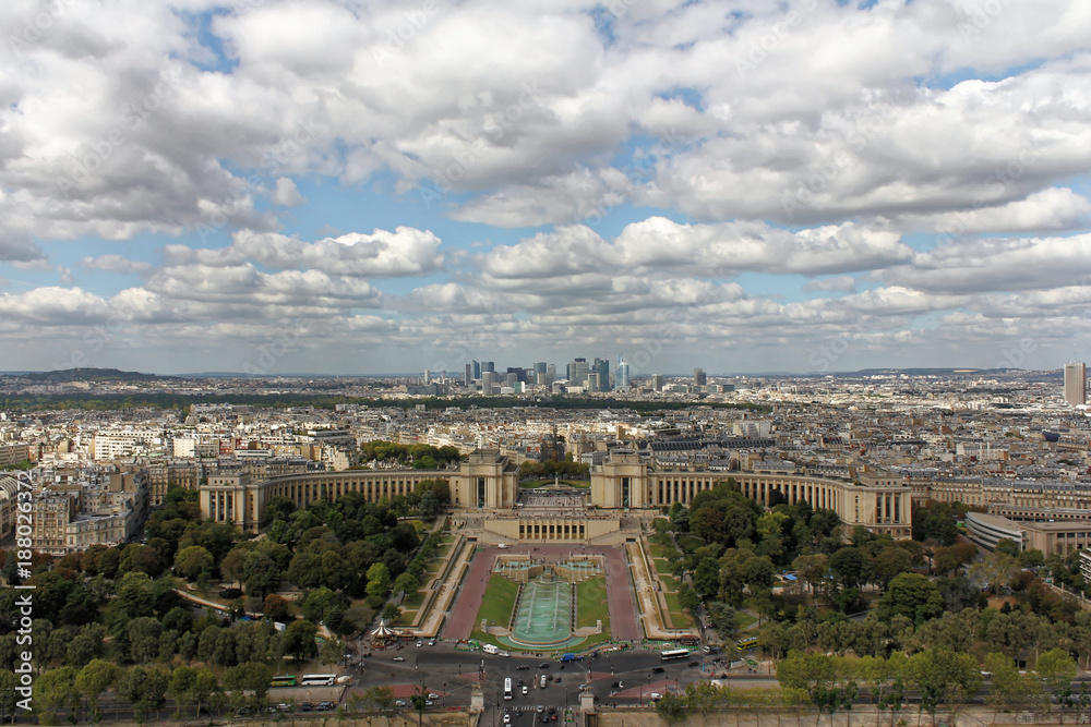 Aerial view over the city from the top of the Eiffel Tower in Paris, France. The Champ de Mars. 
