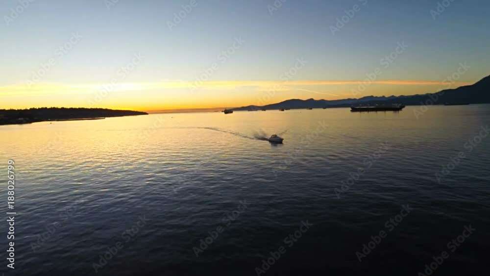 Aerial drone shots of flying through the docks at sunset