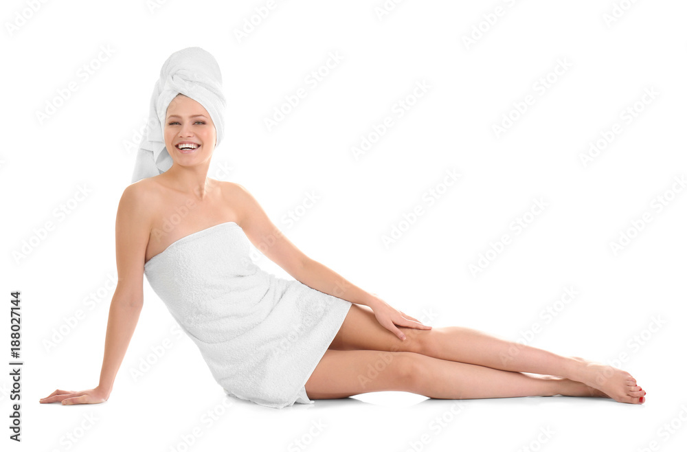 Attractive young woman in towel on white background Attractive young woman in towel on white background