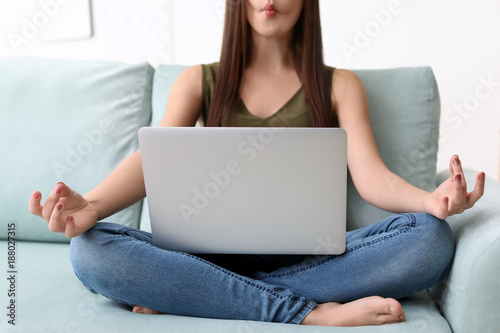 Young woman with modern lap...