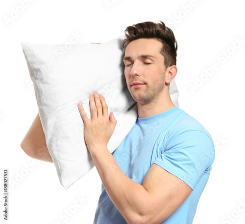 Young man with soft pillow ...