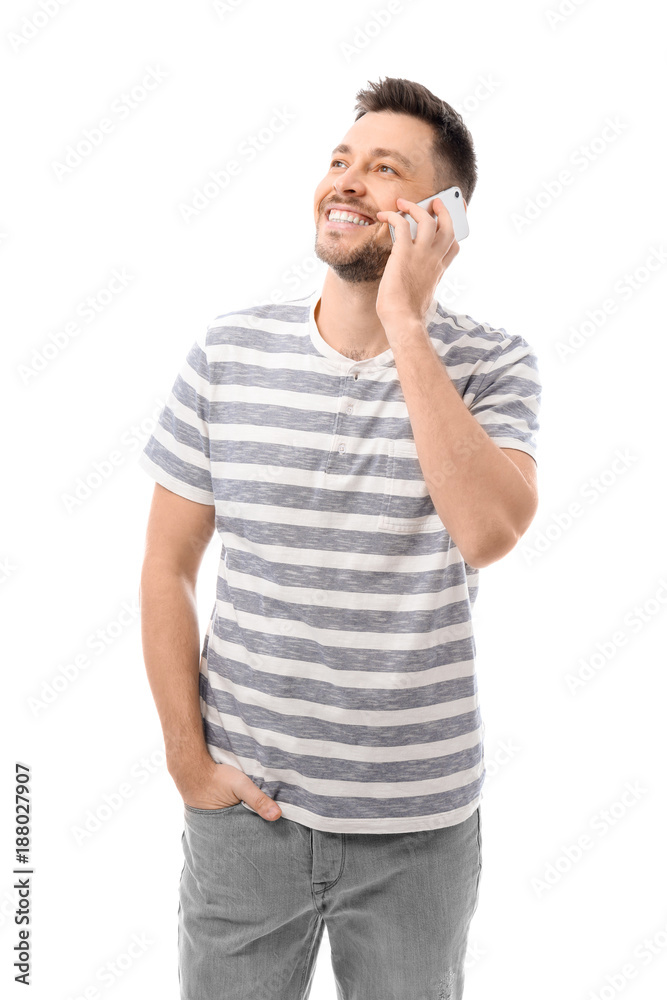 Attractive young man talking on mobile phone on white background Attractive young man talking on mobile phone on white background