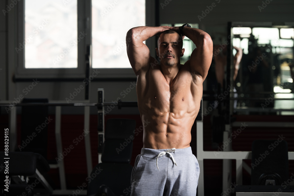 Serious Bodybuilder Standing In The Gym Serious Bodybuilder Standing In The Gym
