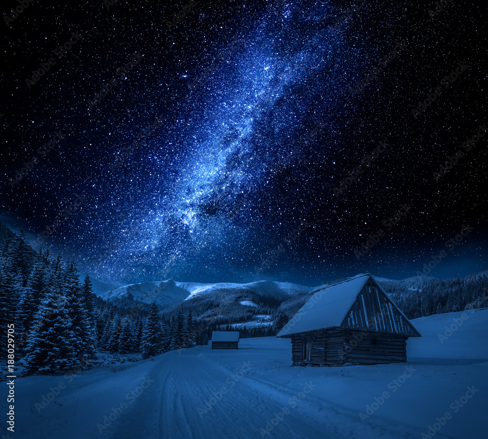 Obraz premium Milky way, cottages and snowy road at night, Tatra Mountains