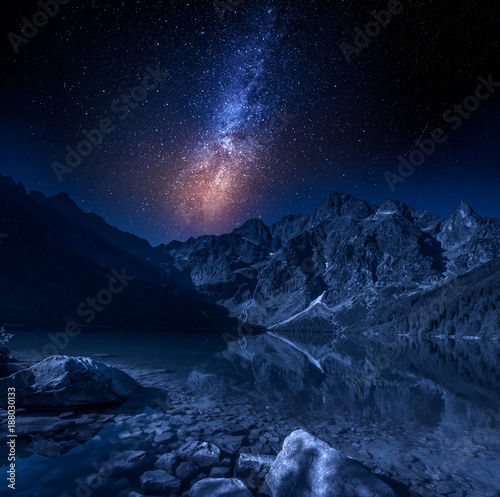 Milky way at the mountains lake at night, Poland, Europe