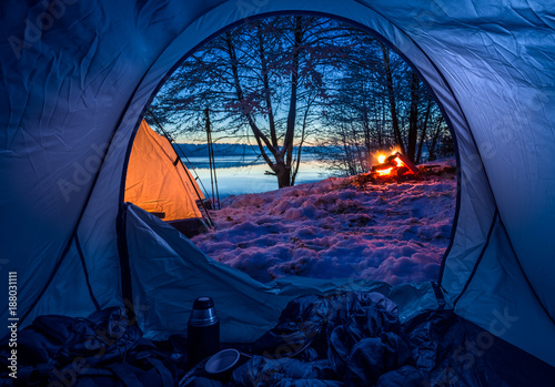 Camp by the lake with campf...