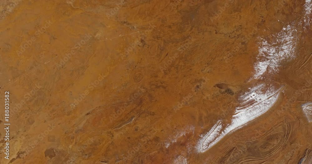 Very high-altitude overflight aerial of snow in the Sahara Desert, El Bayadh Province, Algeria. Clip loops and is reversible. Elements of this image furnished by USGS/NASA Landsat Very high-altitude overflight aerial of snow in the Sahara Desert, El Bayadh Province, Algeria. Clip loops and is reversible. Elements of this image furnished by USGS/NASA Landsat