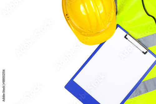 Saftey hi vis vest and hard hat with a clipboard