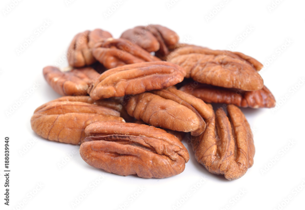 Pecan nuts pile on white background isolated Pecan nuts pile on white background isolated