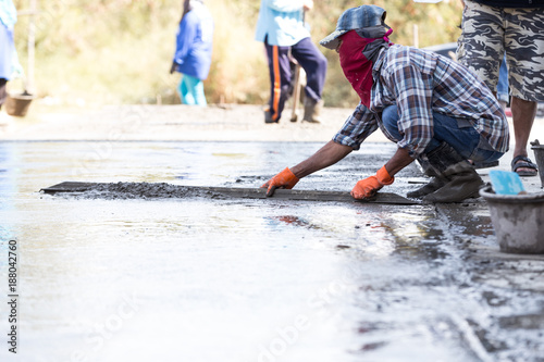 Industry construction men workers with tool concrete mix on road construction