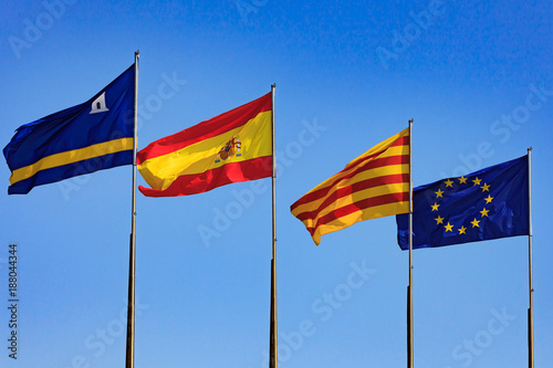 Flags of Spain, Salou, Catalonia, European Union against blue sky