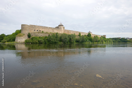 Panorama of the Ivangorod Fortress and the Narva River on a cloudy August day. Ivangorod, Russia
