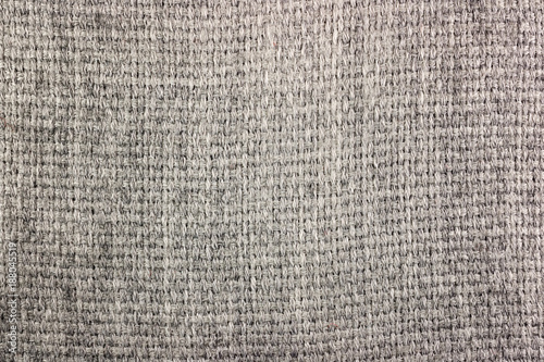 Grey wool knitted texture. Wool fabric background