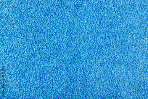 Texture of blue terry cloth closeup. Natural fabric background