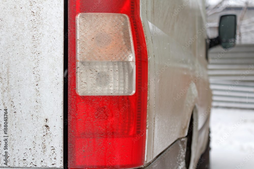 Dirty track tail light closeup. Car in winter Dirty track tail light closeup. Car in winter