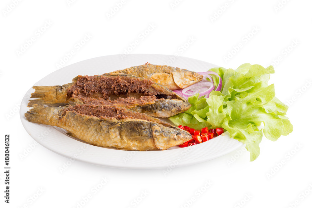 Deep-fried Sea Bass in Fish Sauce isolated on white background Deep-fried Sea Bass in Fish Sauce isolated on white background