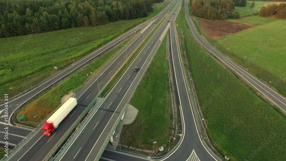 Aerial of Cars and Trucks On Highway Crossroads at Sunset Aerial of Cars and Trucks On Highway Crossroads at Sunset