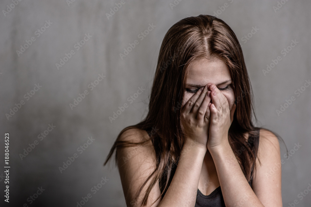 the crying teenage girl covered her face with her hands the crying teenage girl covered her face with her hands