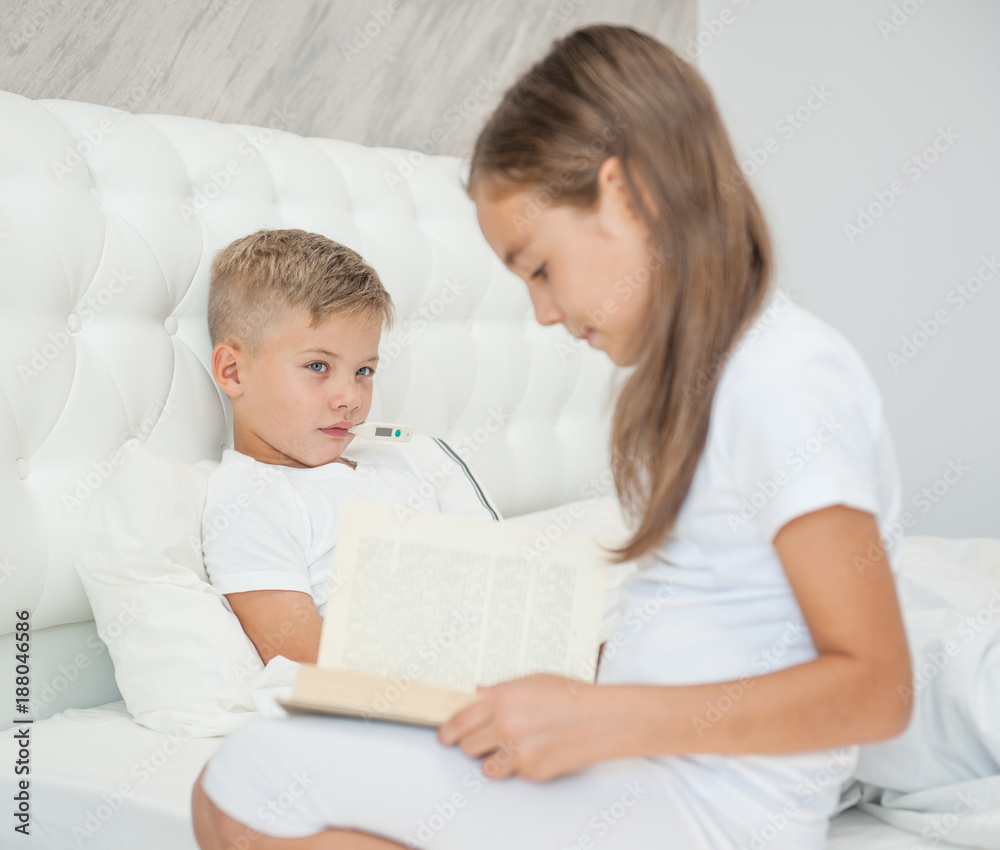 the sister helps to study the sick brother the sister helps to study the sick brother