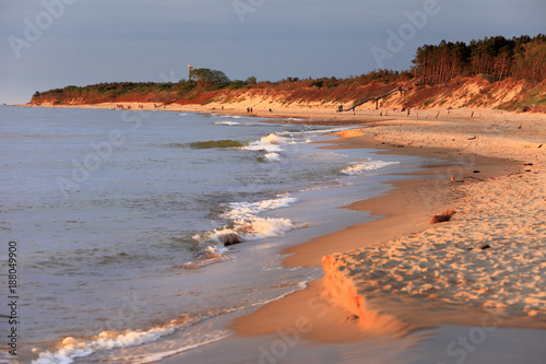 Baltic Sea shore line and beach in Rowy, Poland during sunset