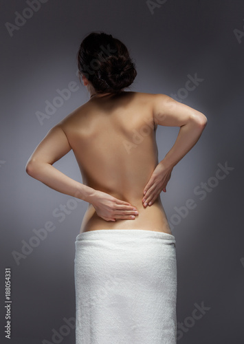 Woman massaging pain back