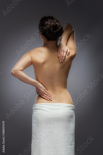 Woman massaging pain back