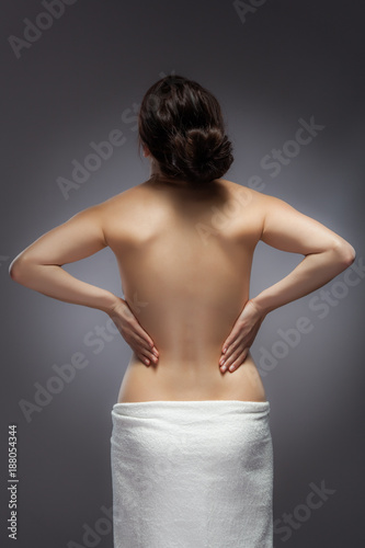 Woman massaging pain back