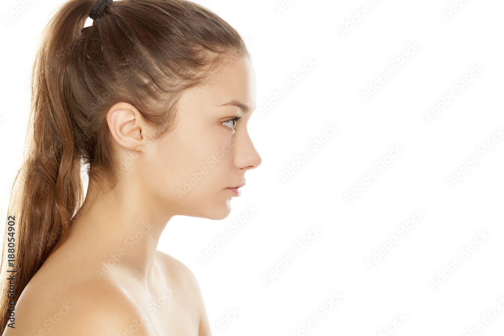 Naklejka premium profile of young girl without makeup on white background