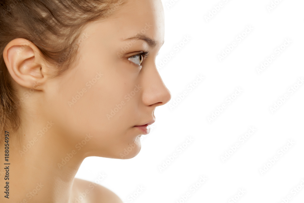 profile of young girl without makeup on white background profile of young girl without makeup on white background