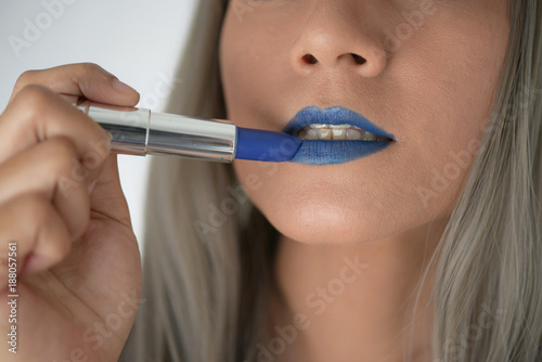 Asian girl make up blue lipstick on her mouth  