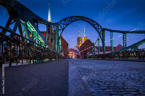 famous old bridge on island Tumski with cathedral of St. John at dusk. Wroclaw, Poland, EU. A long time shutter exposure.