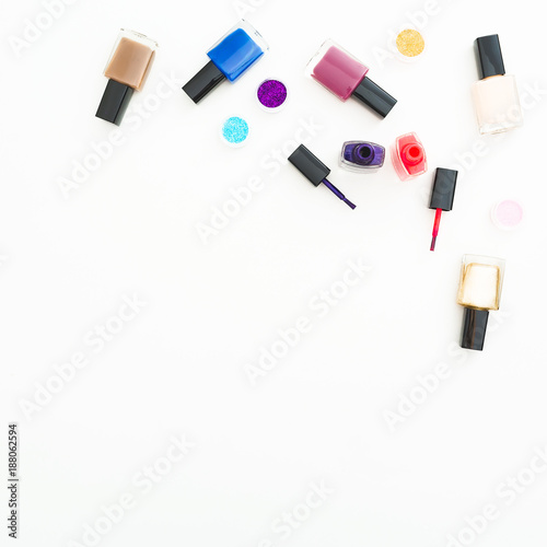 Feminine desk with cosmetics on white background. Flat lay, top view. Beauty background for woman