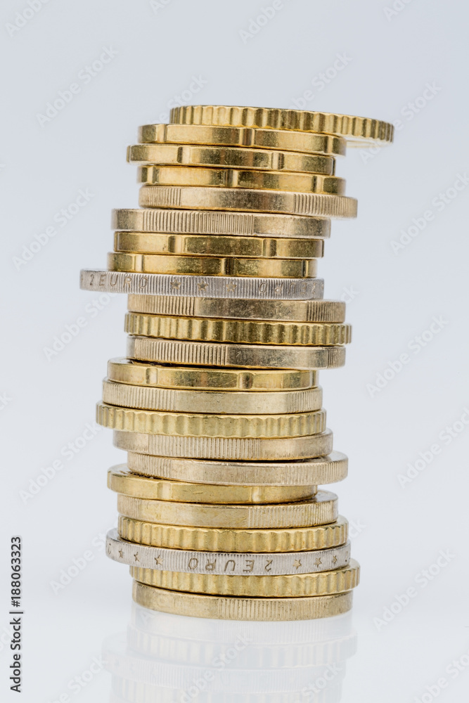 stack of coins in front of white background stack of coins in front of white background