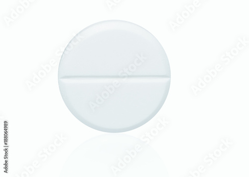 Macro shot of white chewable tablets pills on white background with shadows. Antacids pills for relief stomachache from excess gastric acid in stomach. Stress induce gastric ulcer treatment concept.