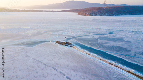 Aerial view of the Tokarevskiy lighthouse - one of the oldest lighthouses in the Far East, still an important navigational structure and popular attractions of Vladivostok city, Russia. photo