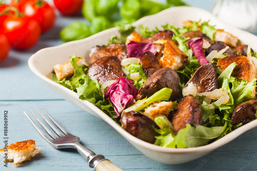Warm salad with grilled chicken liver and toast