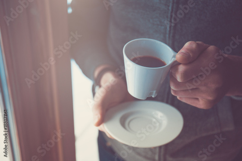 Hand holding coffee cup